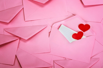 close up Stacking of pink envelopes and a  mail letter paper and red herat , romance  love letter concept for holiday valentines day greeting card concept