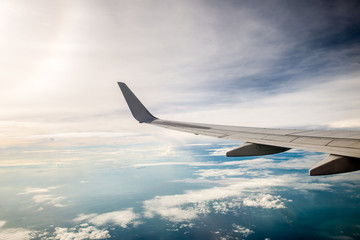 Fototapeta na wymiar airplane wing with beautiful sky
