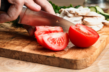 slicing vegetables with a knife for cooking