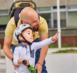 Father teaching his son to ride a bike