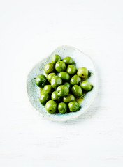 Organic Green Olives on a Ceramic Plate