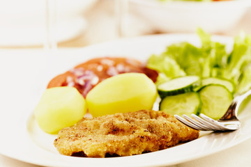 Schnitzel with potatoes and vegetables