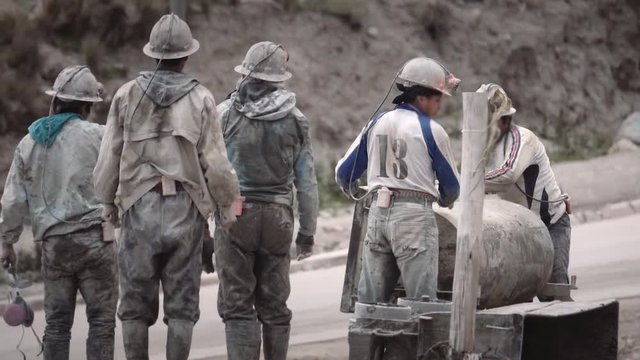 Group of hispanic miners working in a open pit mine, South American mine, Bolivia	