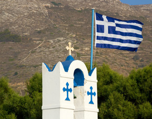 Greek flag on the belfry of Agios Nikolaos church, Parikia, Paros, Cyclades, Greece