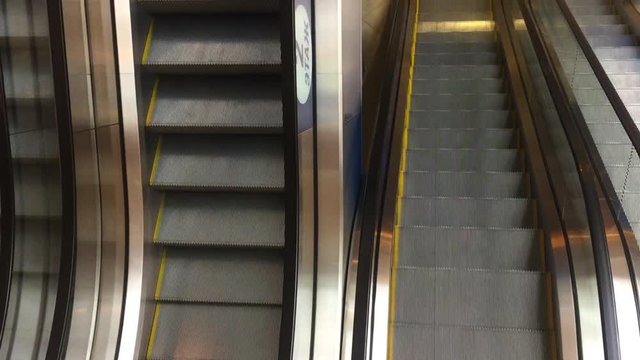 Moving escalator up in a public area. FHD stock footage.