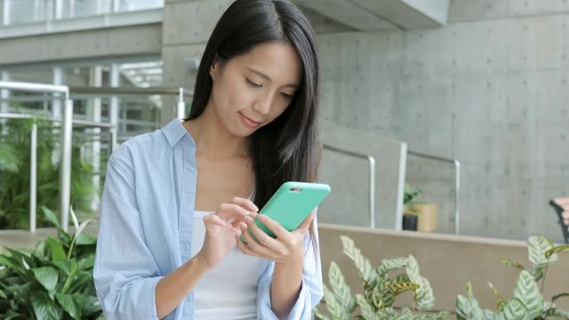 Woman working on cellphone