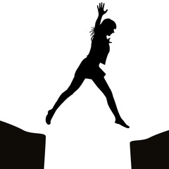 Fototapeta na wymiar Woman jumping over a gap