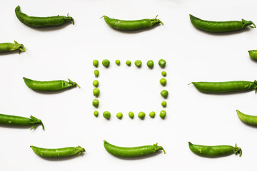 Green peas on a white background. Pea frames.
