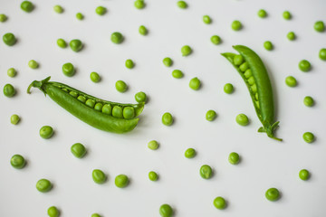 Green peas on a white background. 