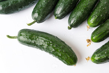 Freshly washed cucumbers on a wooden table