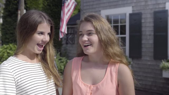 Portrait Of Happy Teen Girls In Front Of New England House (Decorated For Independence Day)