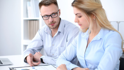 Successful business people working at meeting in office background