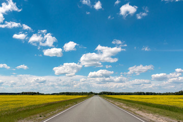 Blue sky with white clouds over the highway