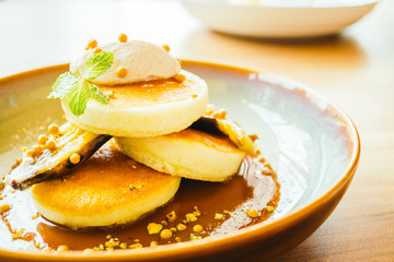 Sweet dessert pancake with banana and sweet sauce