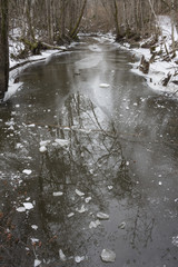 Icy river floating slow during winter. - 163013470