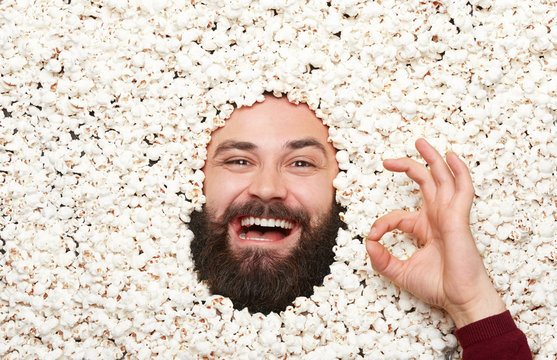 Man Gesturing In Popcorn