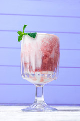 Shake in a glass with syrup