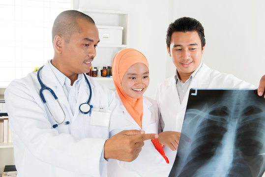 Doctors checking on x-ray image