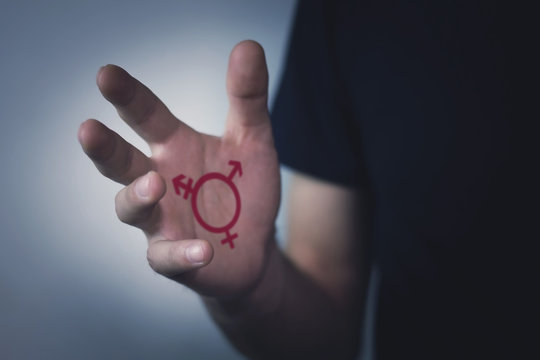 Transgender symbol in the hand.