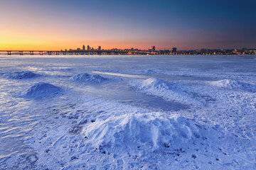 Beautiful winter landscape with frozen river at Dusk III