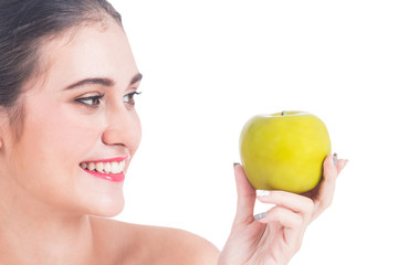 Obraz na płótnie Canvas Beautiful woman holding apple