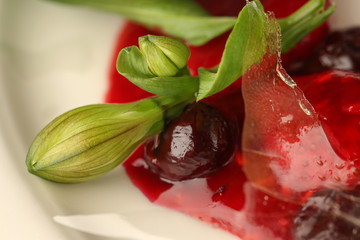 Cherry dessert on a white plate. Close up