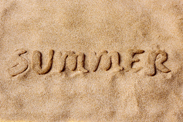 word summer in the sand of a beach