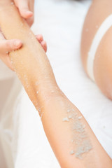 Woman Getting a Salt Scrub Beauty Treatment in the Health Spa