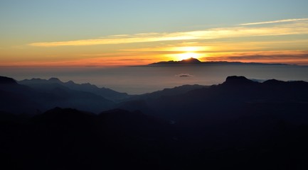 Fototapeta premium Sunset, Gran canaria in foreground and Tenerife in background, Canary islands