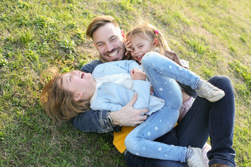 Fototapeta premium Father with his two daughters.