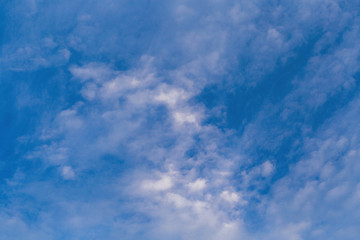 white fluffy clouds in the blue sky