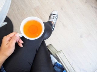 Woman eating hot tea