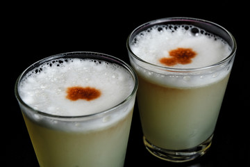 two glasses of cocktail pisco  sour