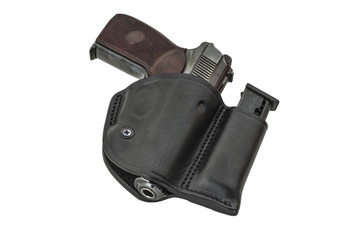The gun in a tactical leather holster. Isolated