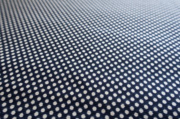 Fabric with polka dot pattern in navy blue and white