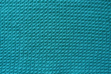 Homemade motton blue knitted fabric from above