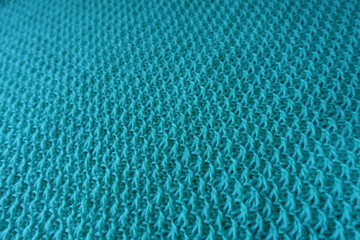 Relief stitches on motton blue handmade knitwork