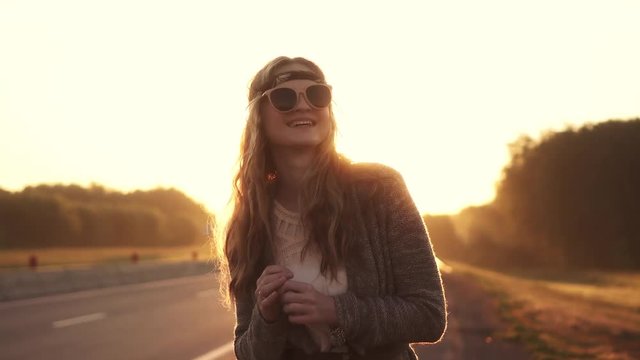portrait of young beautiful girl in sunglasses. girl hipster at dawn