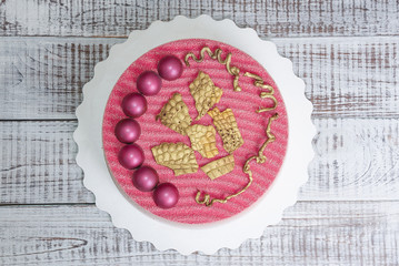 Chocolate velour cake decorated with hemispheres