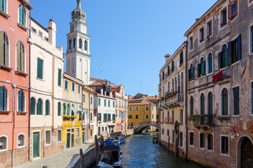 Fototapeta na wymiar Tourists on water street with Gondola in Venice, ITALY