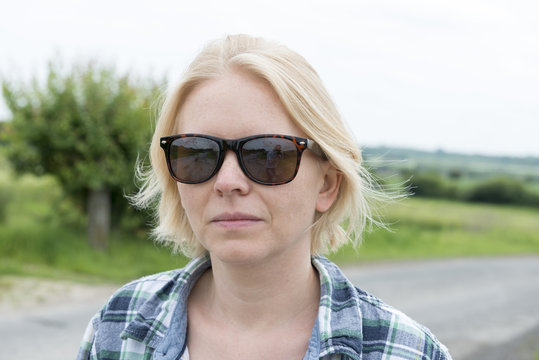 Portrait of Lady in Sunglasses in the Outdoors