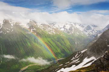 Fototapeta na wymiar Beautiful mountain landscape with rainbow