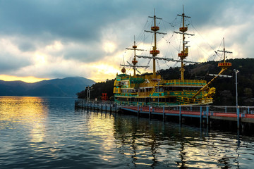 Fototapeta na wymiar Ashi lake at sunset with pirate ship