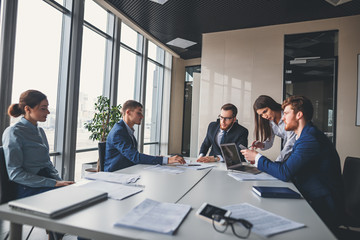 View of a Boss heading a business reunion with partners