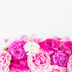 Pink flowers - roses and peonies on white background. Floral composition. Flat lay, top view.