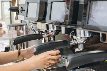barista  making coffee by coffee   machine