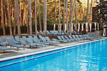 Beautiful stylish modern hotel with a swimming pool. The concept of summer vacation