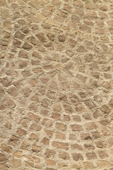 Circles formed by paving stones.
