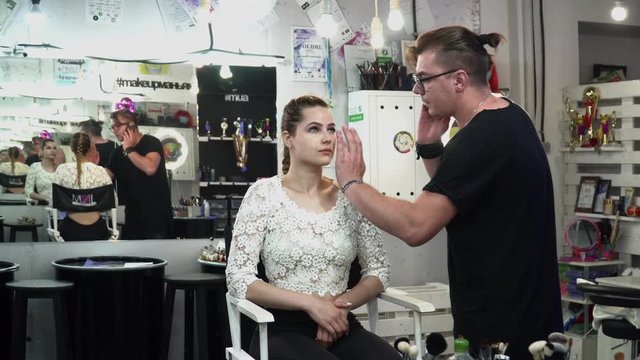 Makeup artist making makeup for a bride