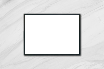 Mock up blank poster picture frame hanging on white marble wall in room - can be used mockup for montage products display and design key visual layout.